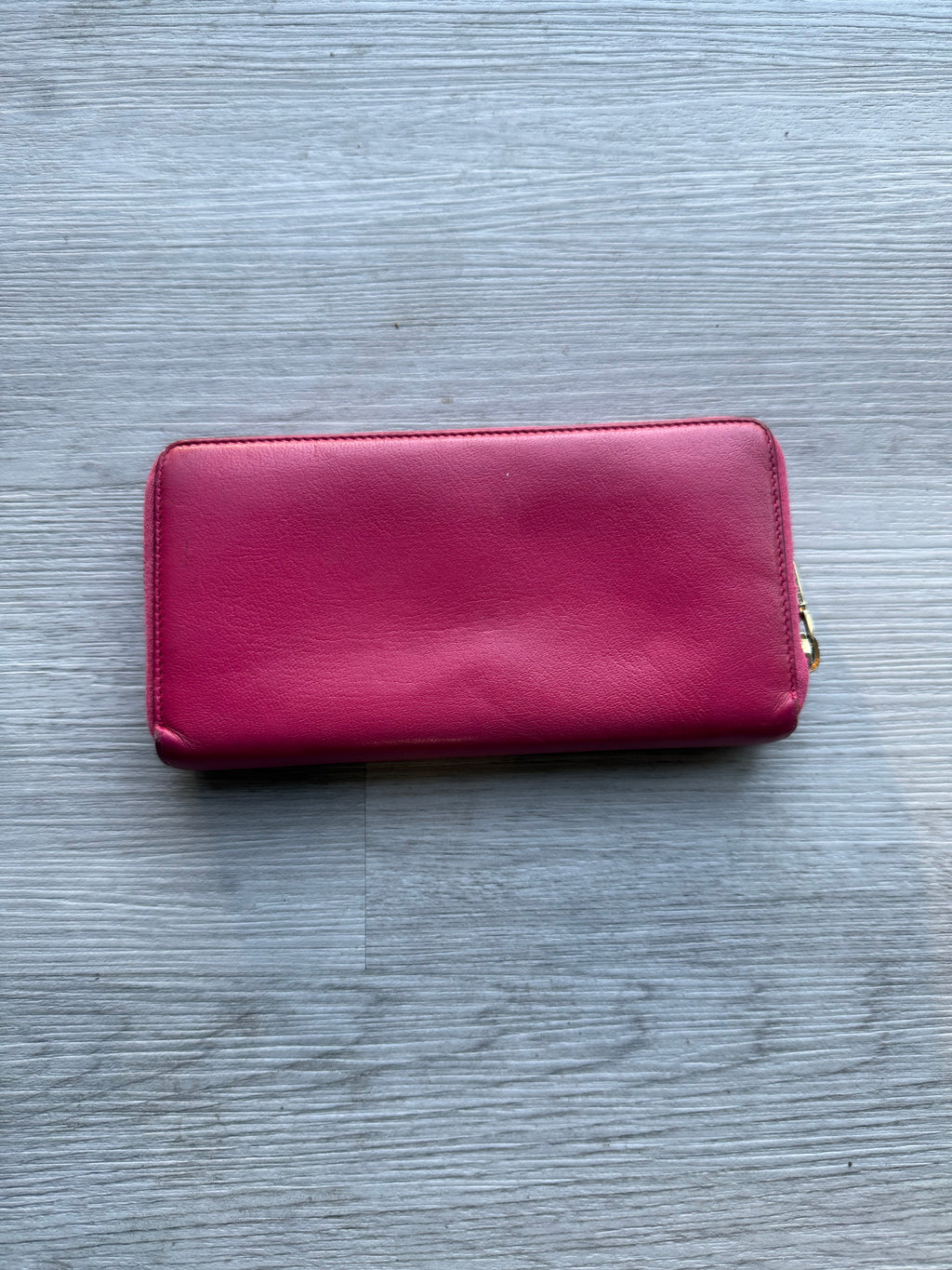 YSL fuchsia leather zip-around continental long wallet with the YSL monogram logo
