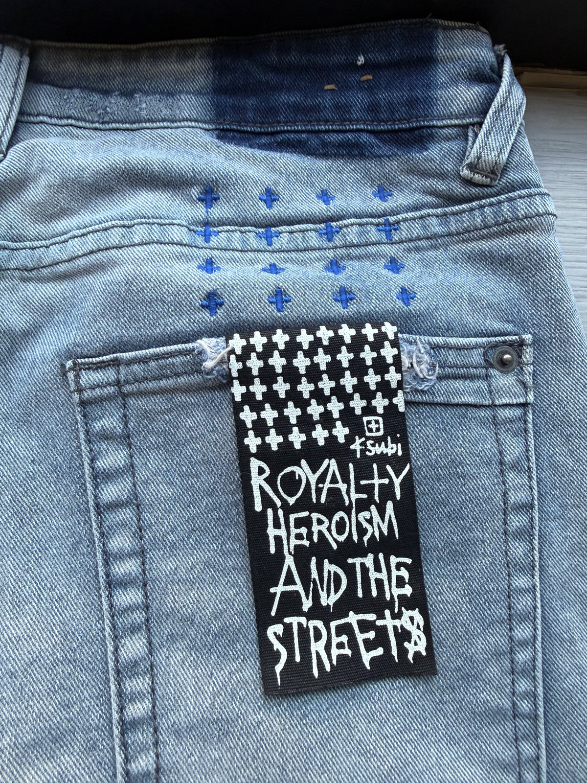 Ksubi ripped blue jeans