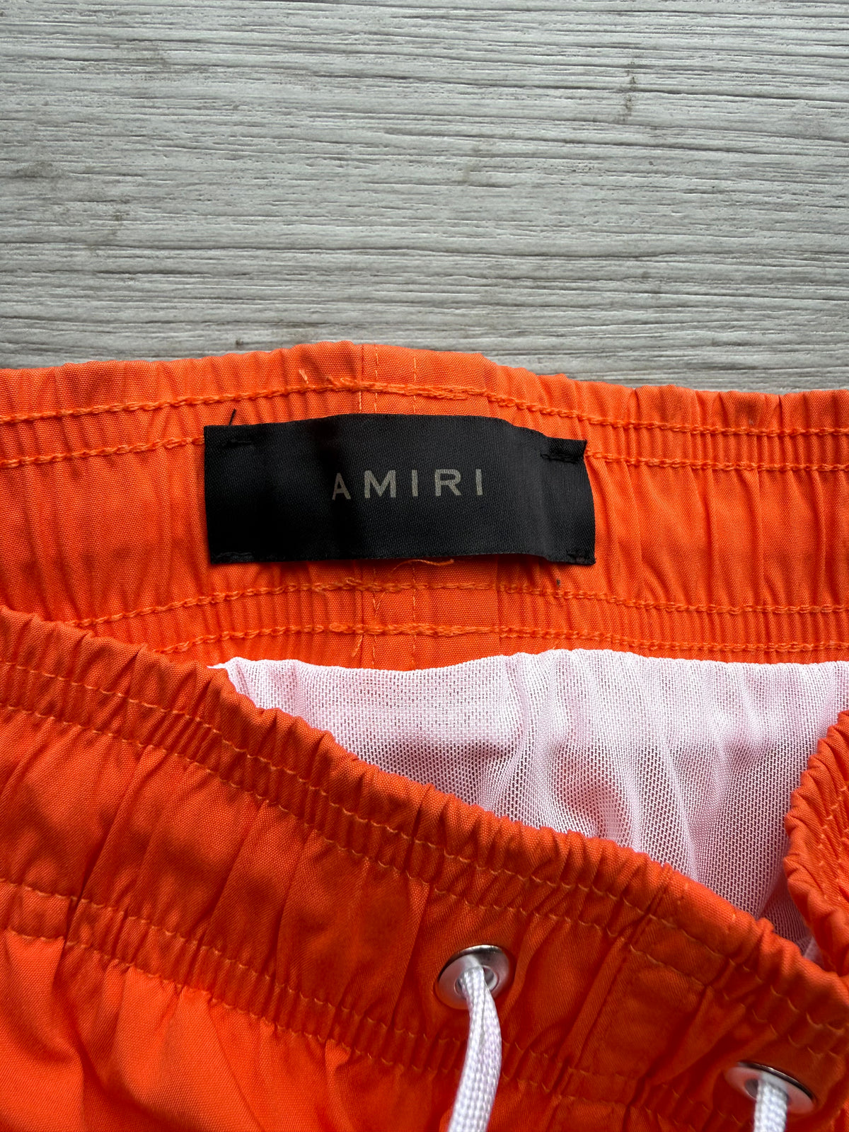 Amiri orange & black ma bar logo swimshorts