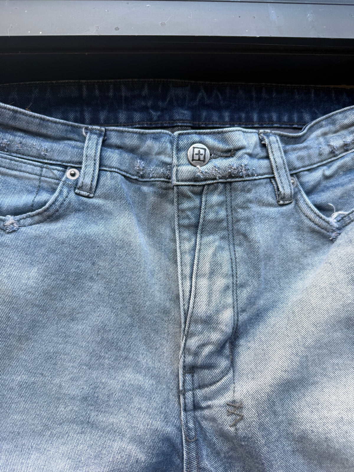 Ksubi ripped blue jeans