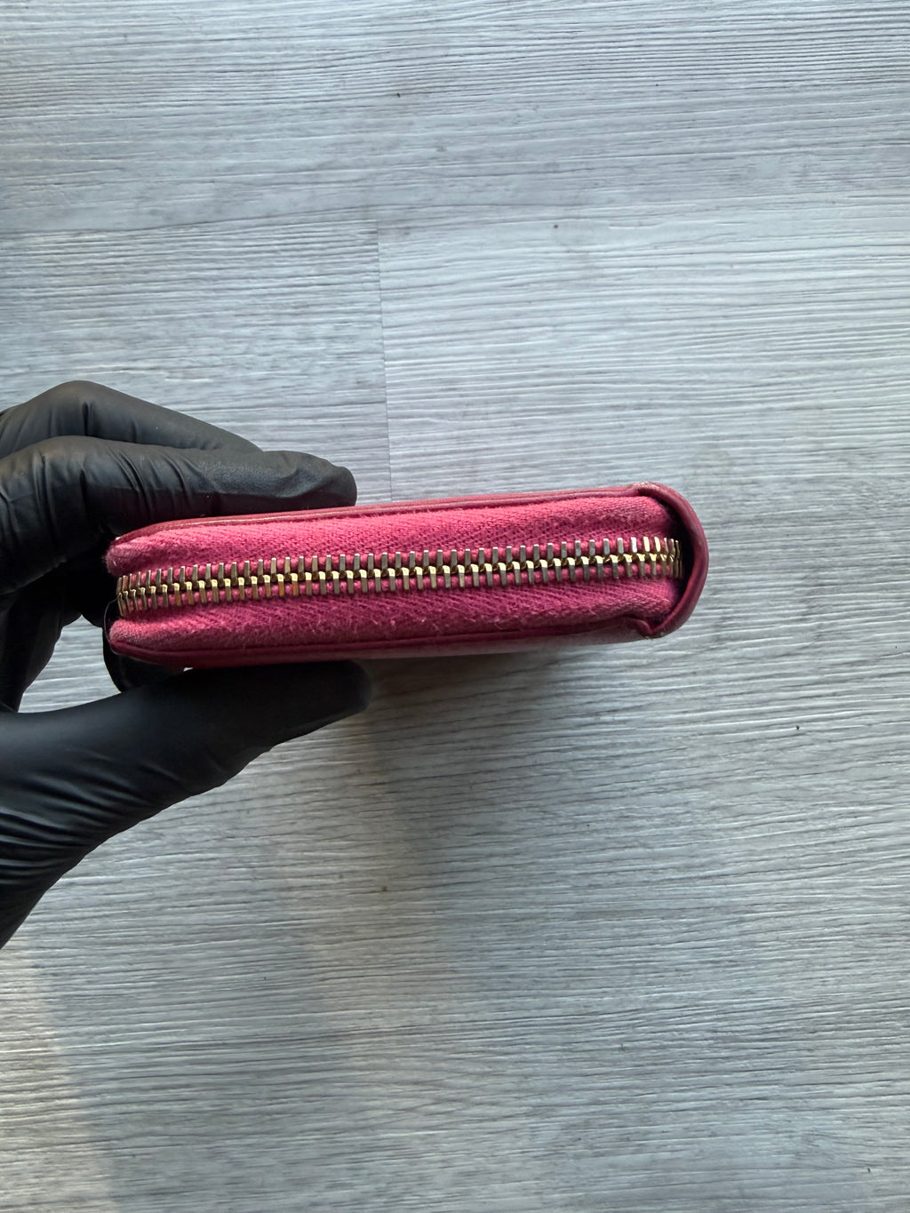 YSL fuchsia leather zip-around continental long wallet with the YSL monogram logo
