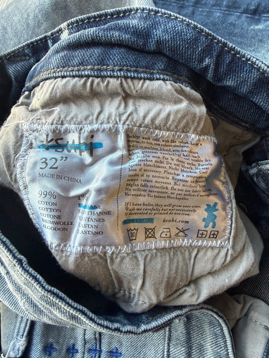 Ksubi ripped blue jeans