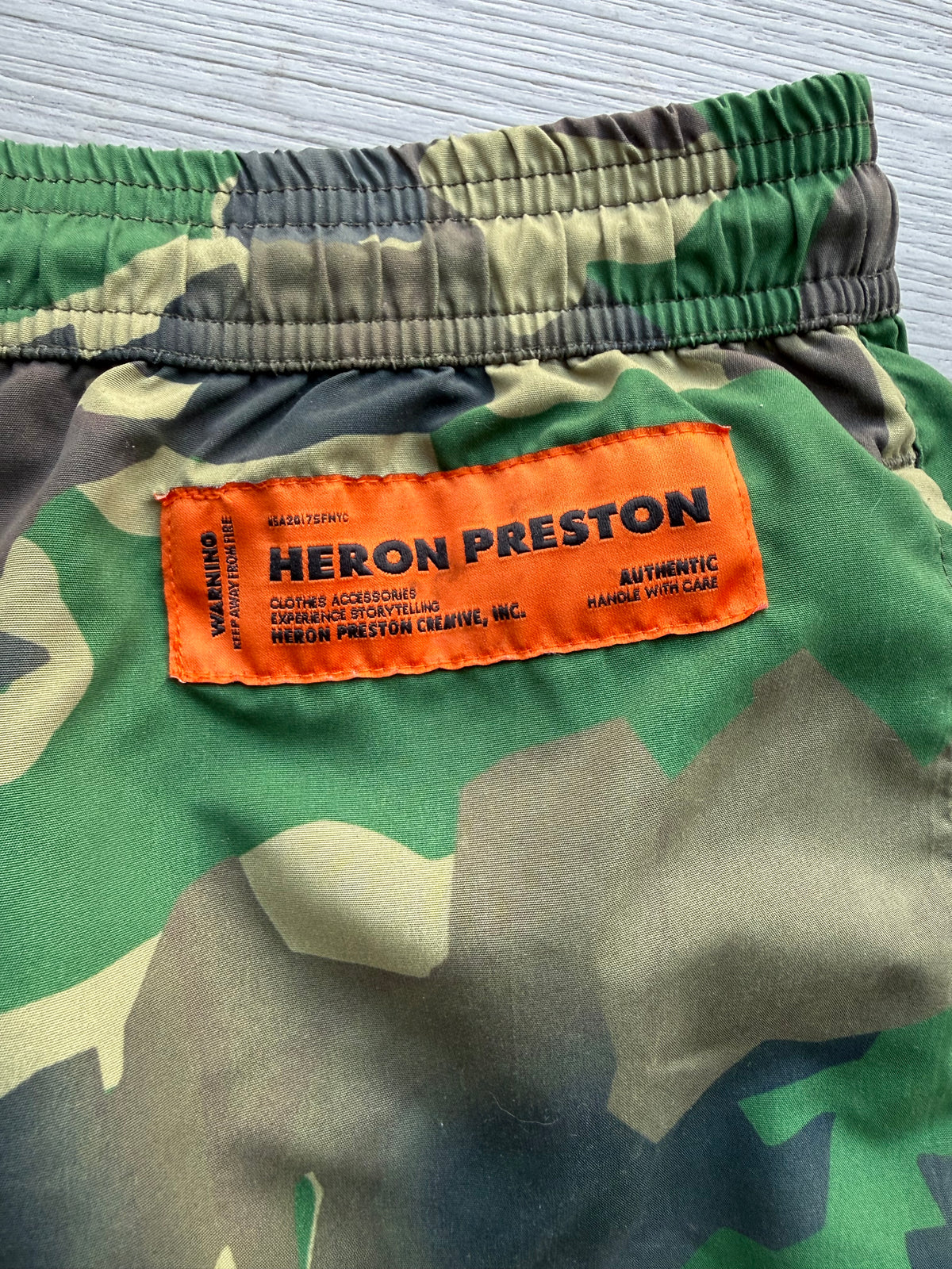 Heron Preston nylon swimshorts military green’