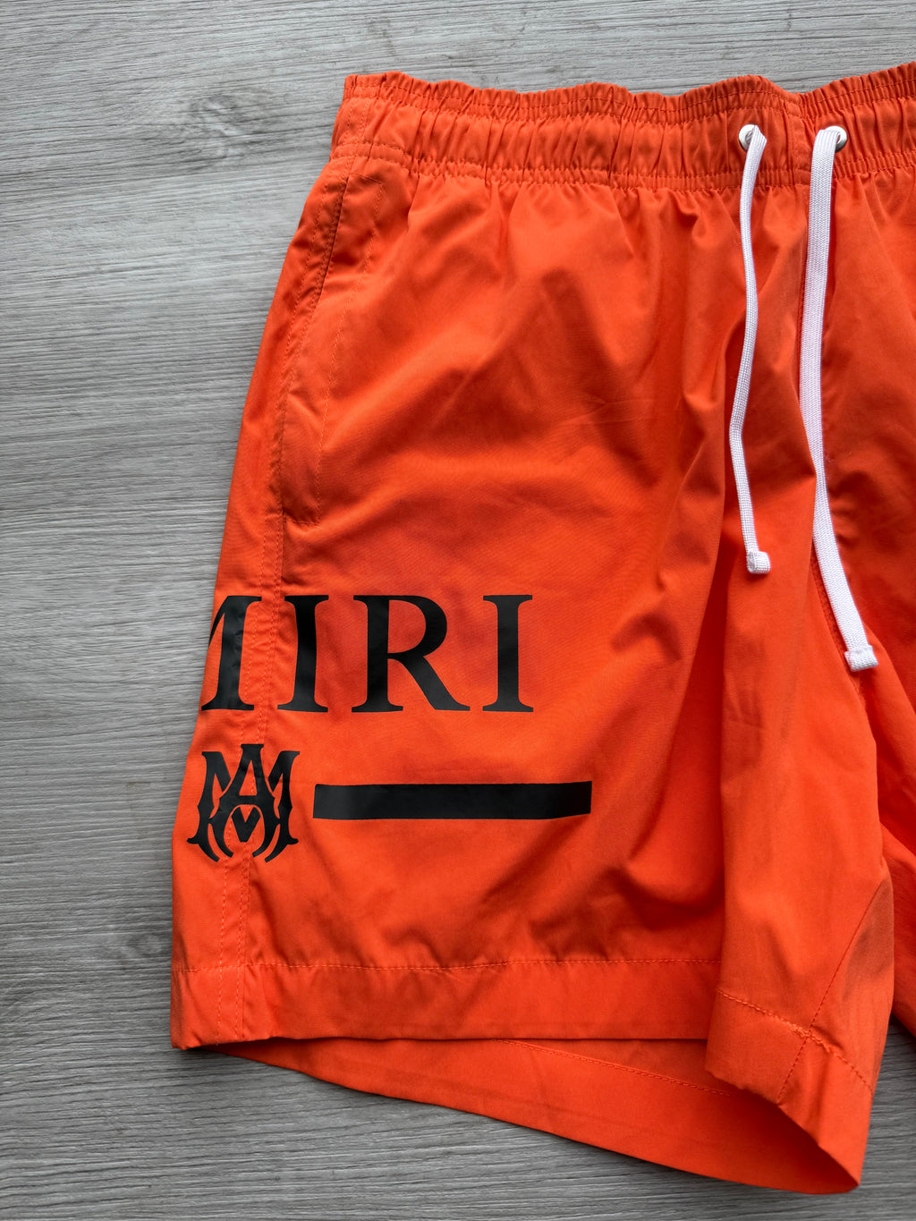 Amiri orange & black ma bar logo swimshorts
