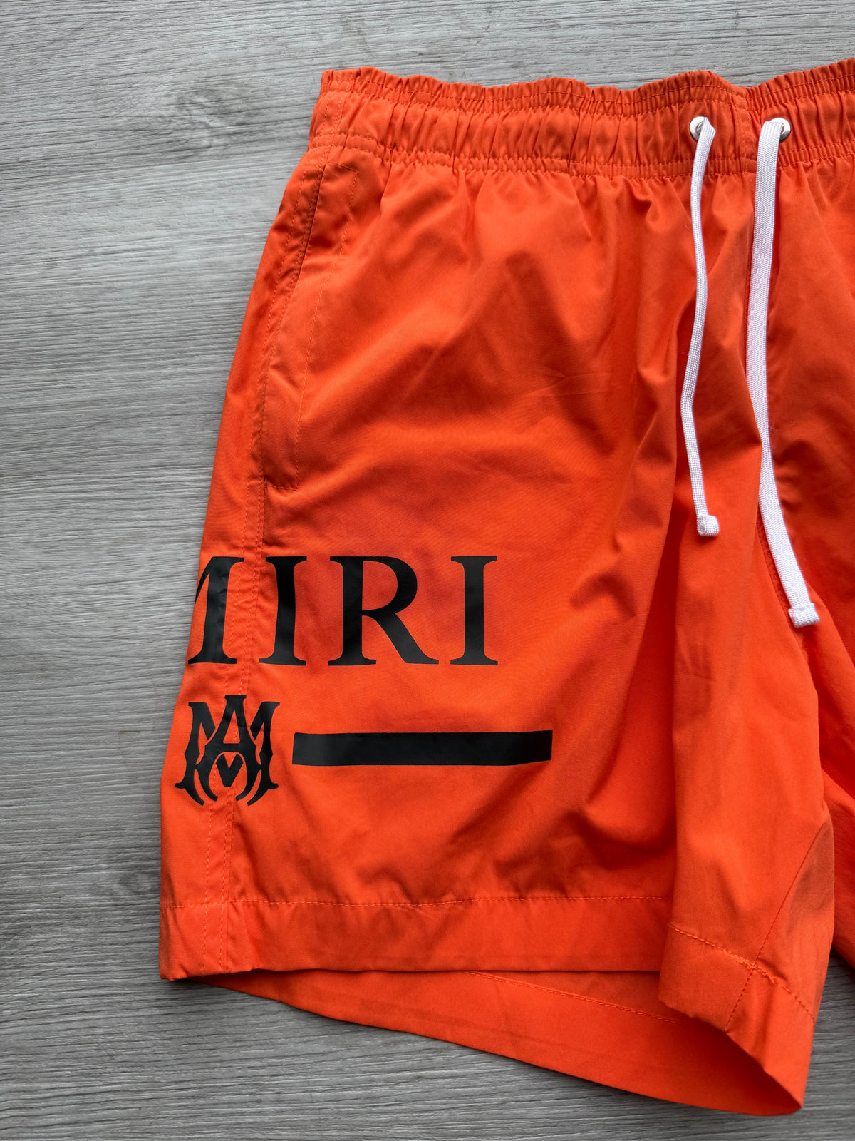 Amiri orange & black ma bar logo swimshorts