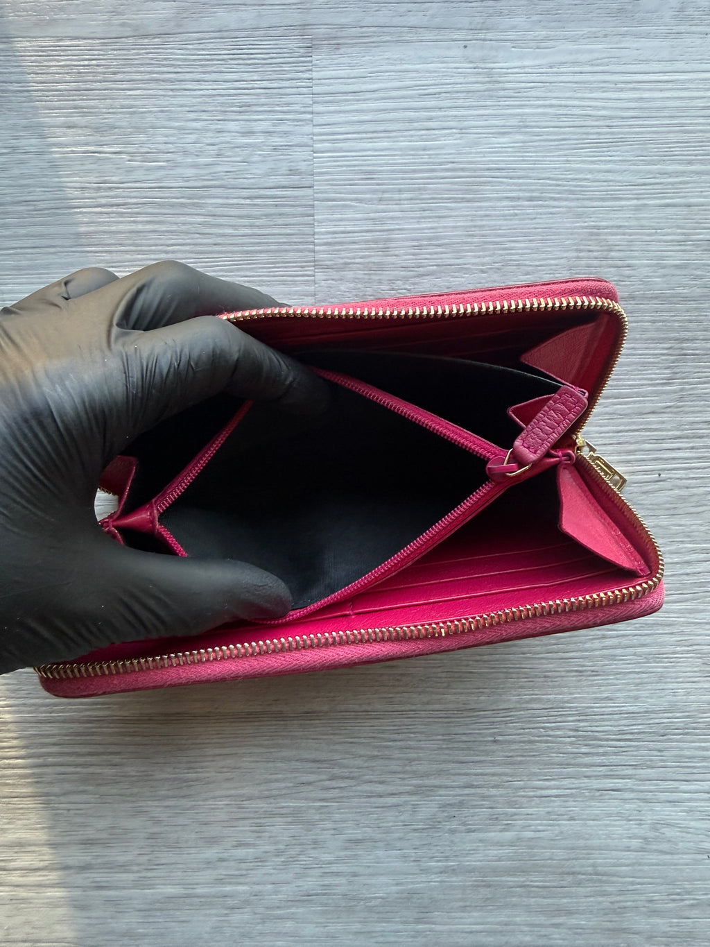 YSL fuchsia leather zip-around continental long wallet with the YSL monogram logo