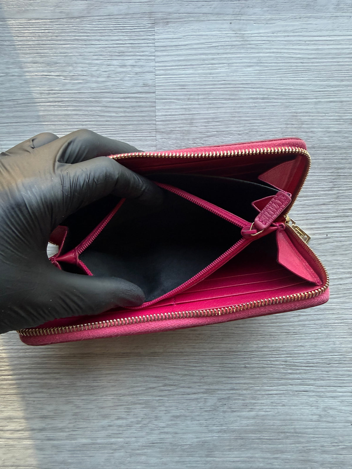 YSL fuchsia leather zip-around continental long wallet with the YSL monogram logo