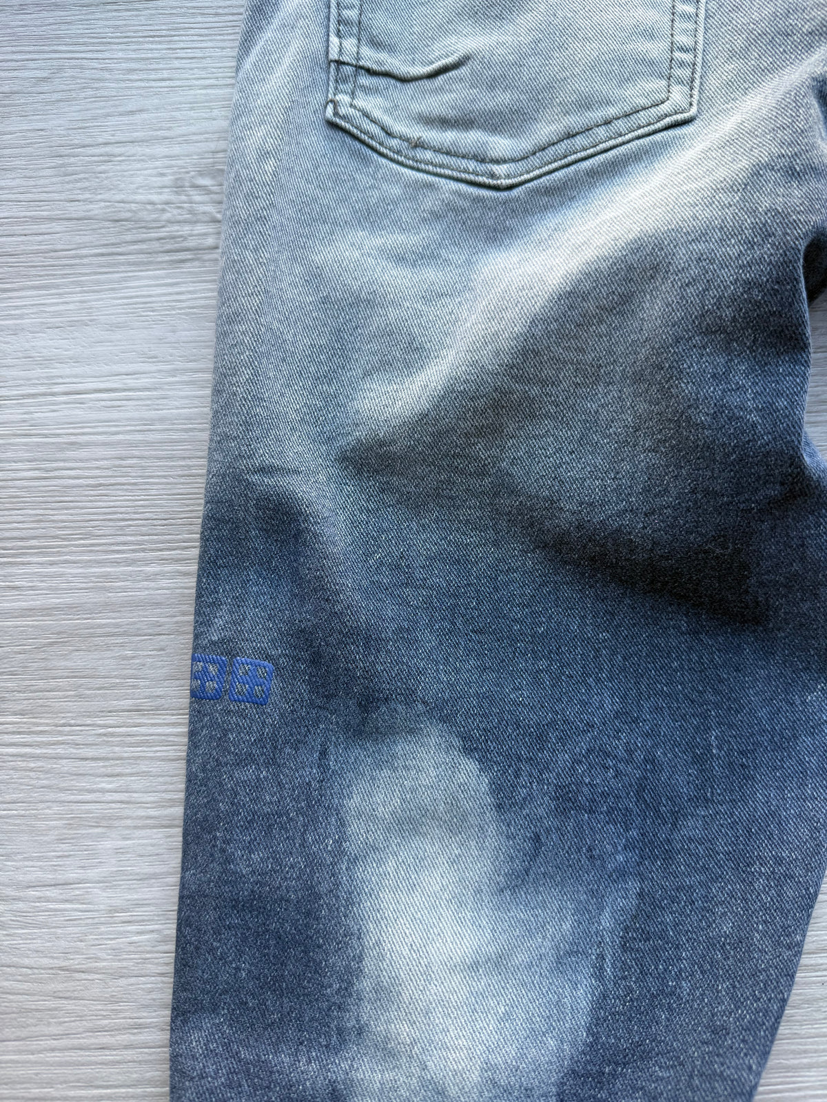 Ksubi ripped blue jeans
