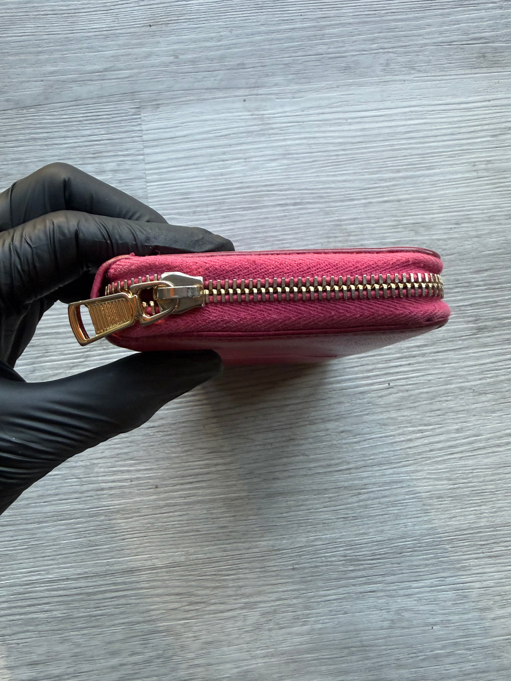 YSL fuchsia leather zip-around continental long wallet with the YSL monogram logo
