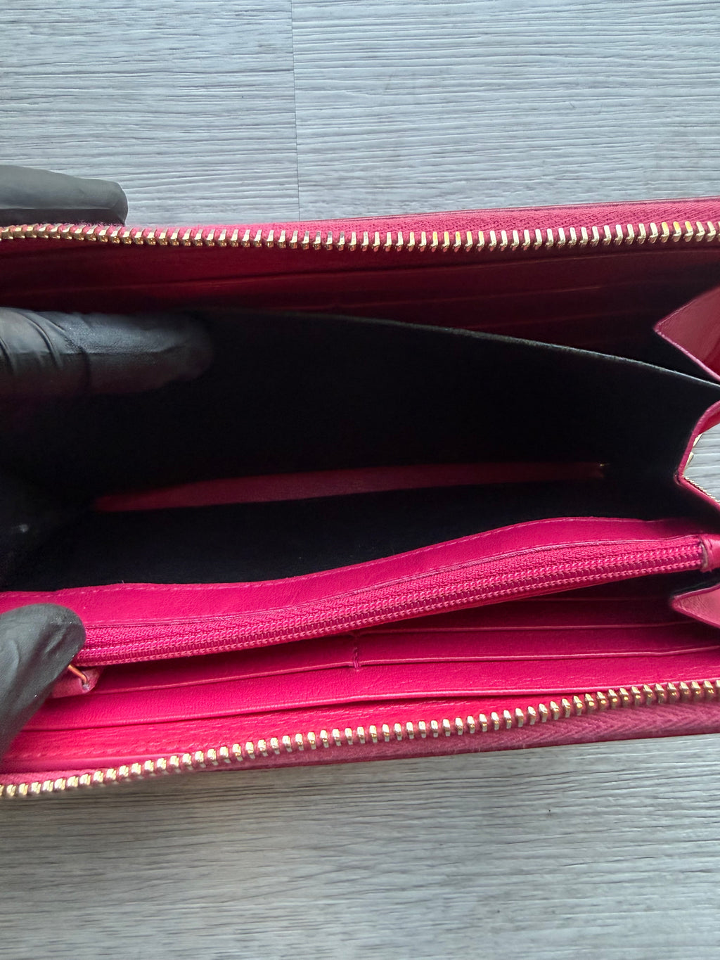 YSL fuchsia leather zip-around continental long wallet with the YSL monogram logo
