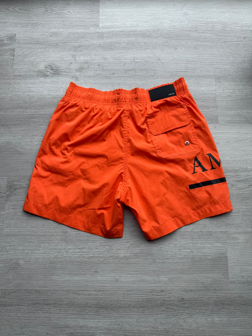 Amiri orange & black ma bar logo swimshorts