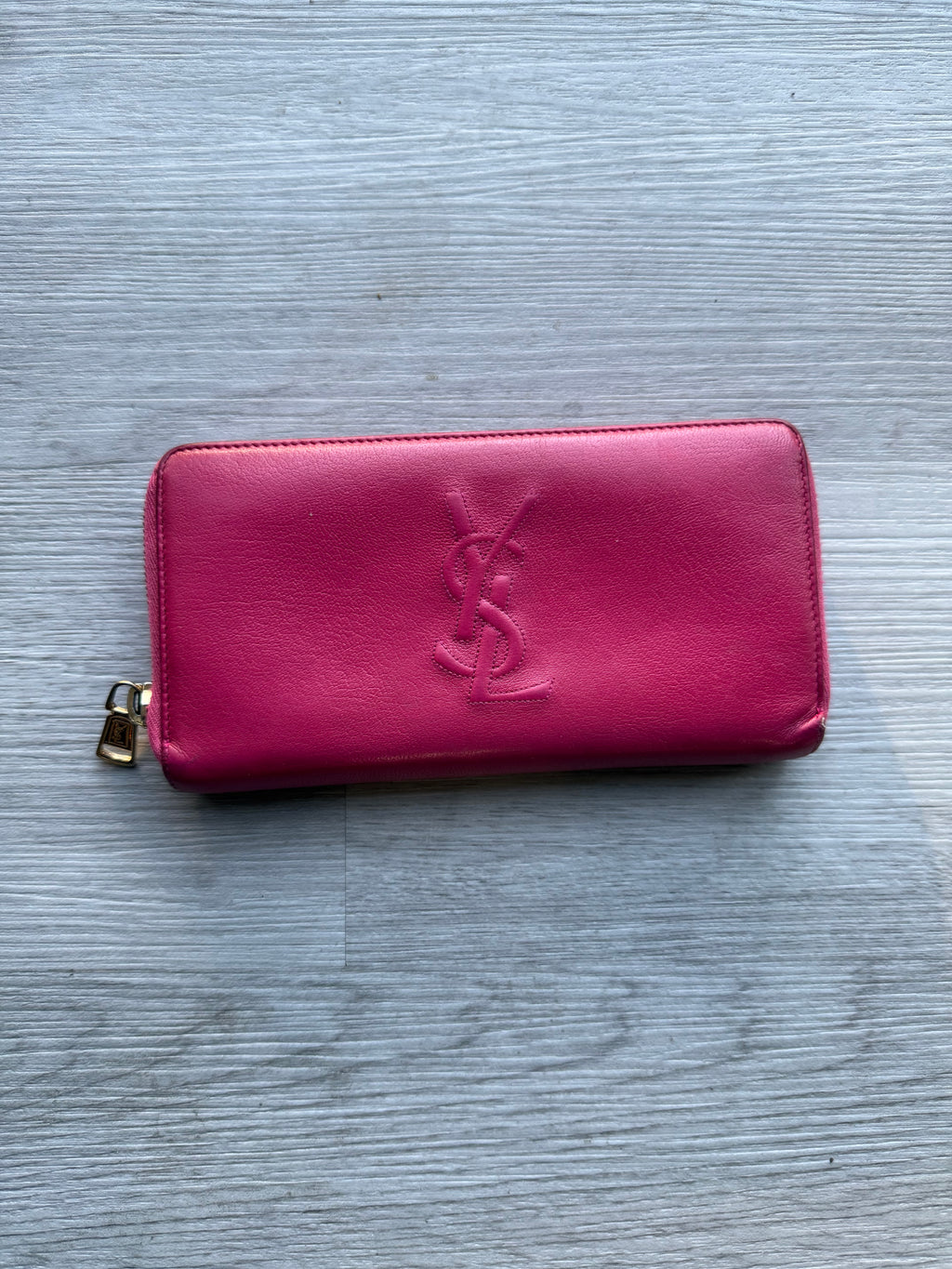 YSL fuchsia leather zip-around continental long wallet with the YSL monogram logo