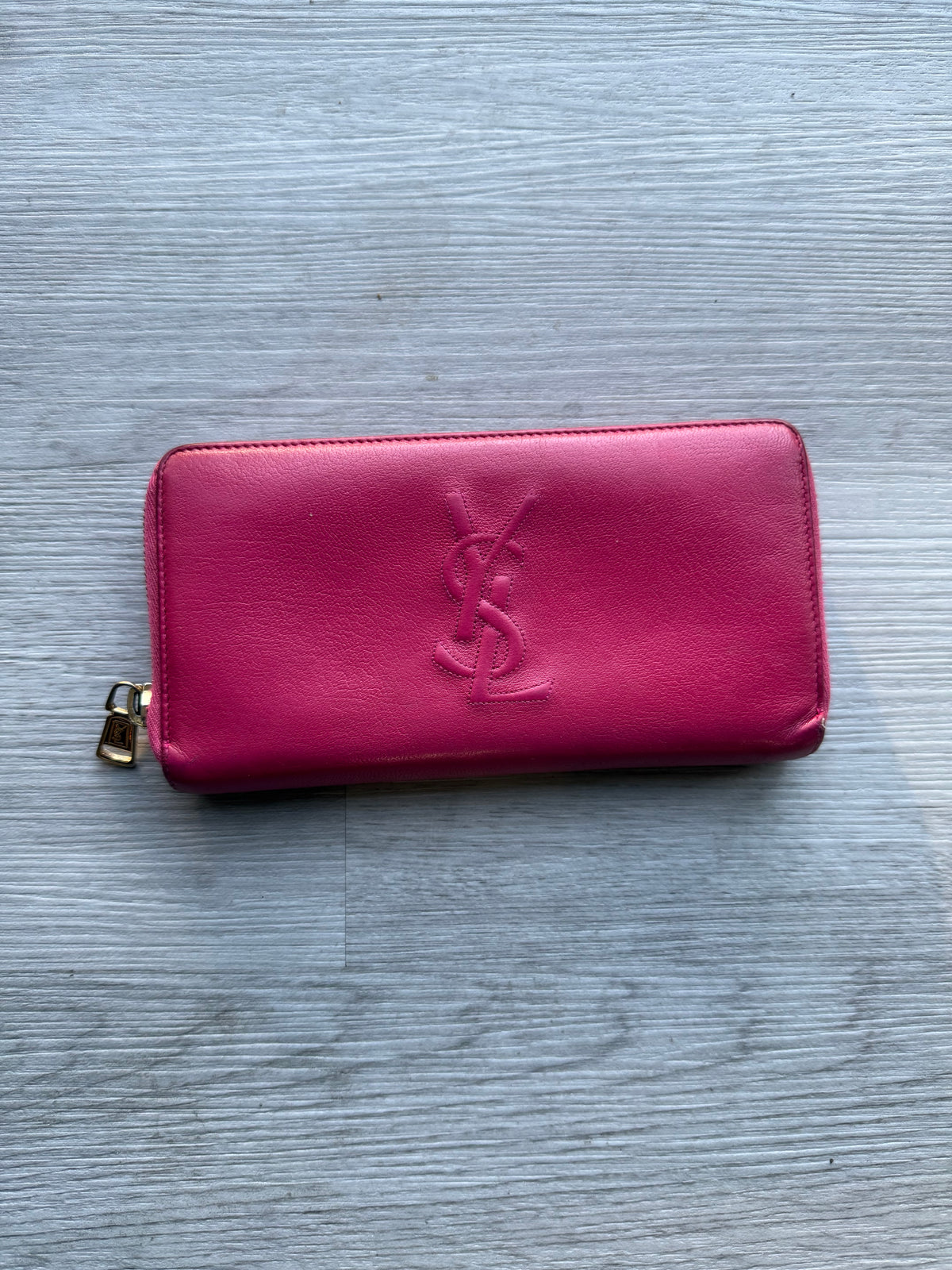 YSL fuchsia leather zip-around continental long wallet with the YSL monogram logo