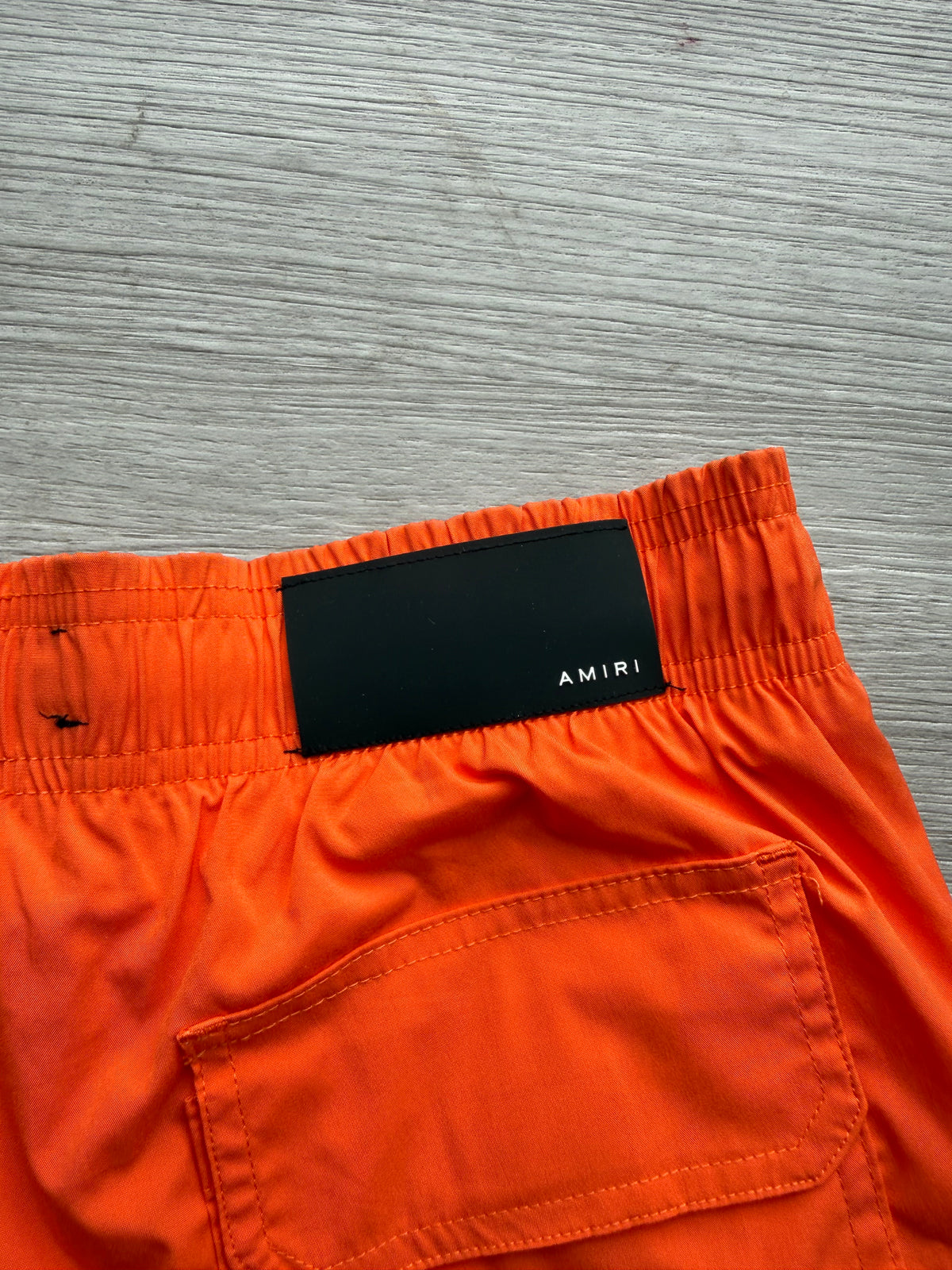 Amiri orange & black ma bar logo swimshorts