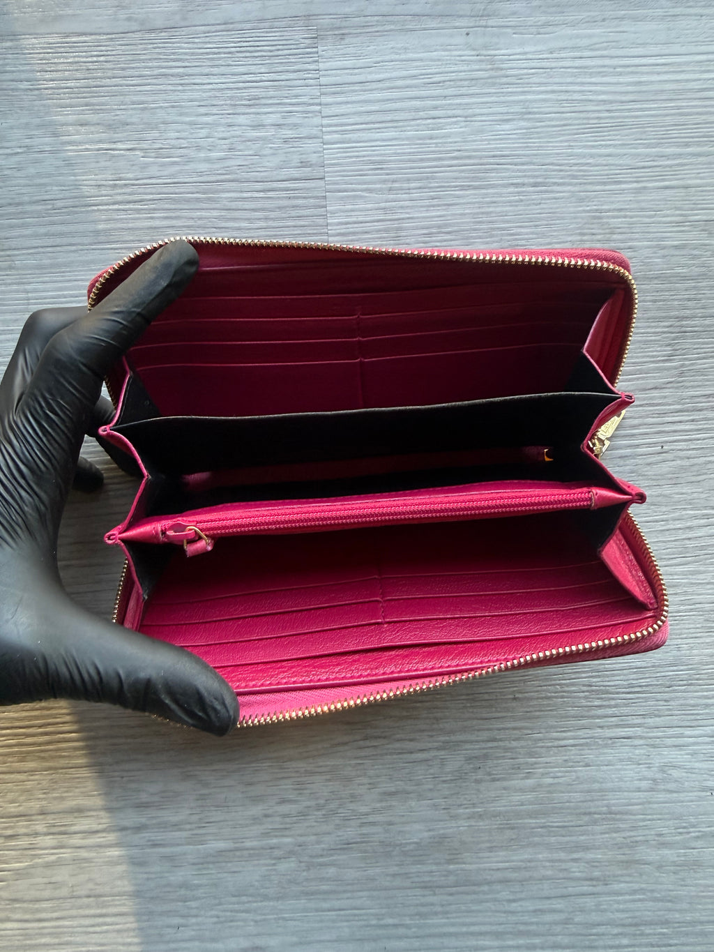 YSL fuchsia leather zip-around continental long wallet with the YSL monogram logo